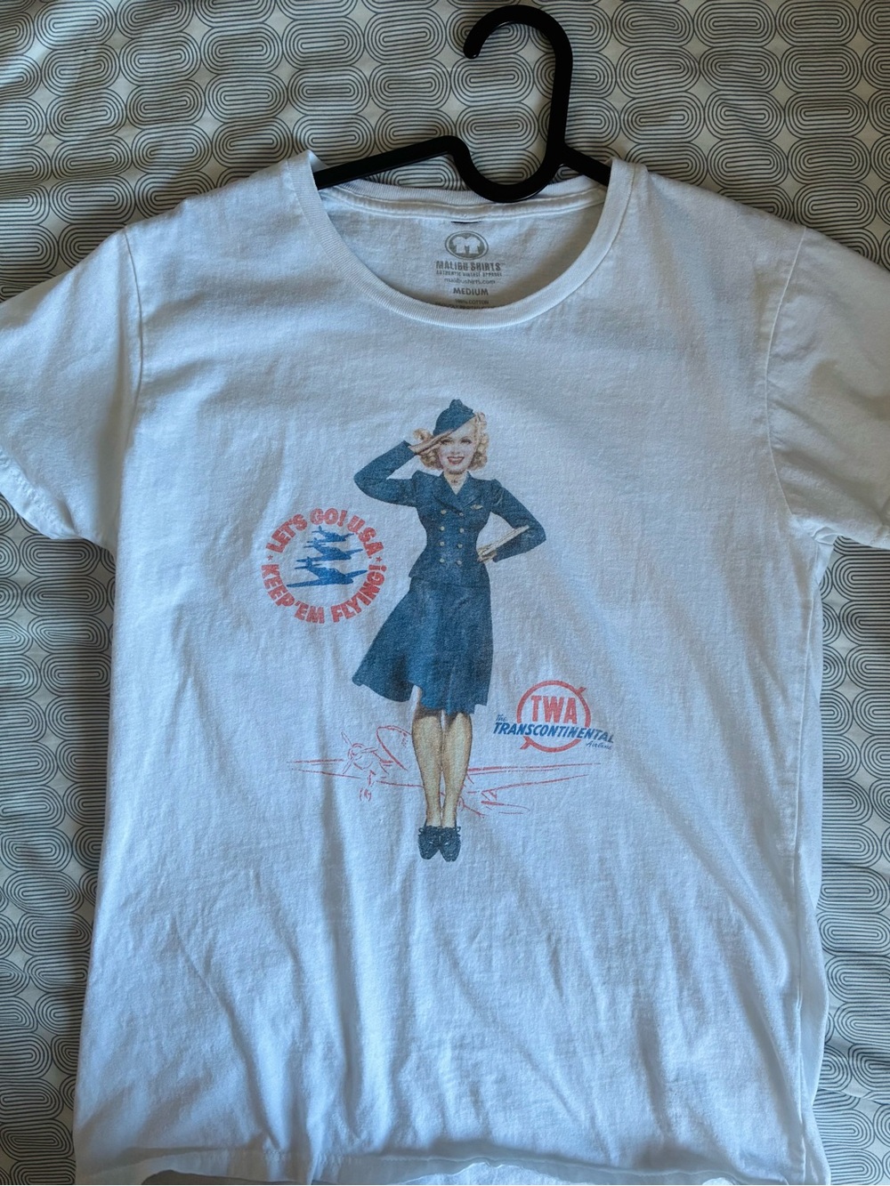 Vintage-Inspired White Graphic Tee with Blue Stewardess Print